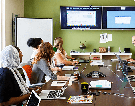 Diverse team sitting around a conference table during a meeting