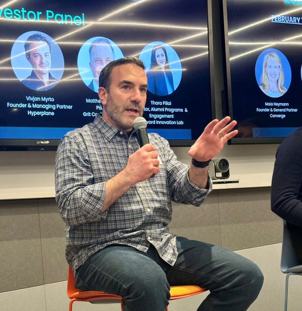 Greg dracon speaking at a conference
