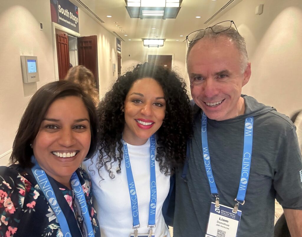 two women and one man of 406 leadership smiling at a health tech conference