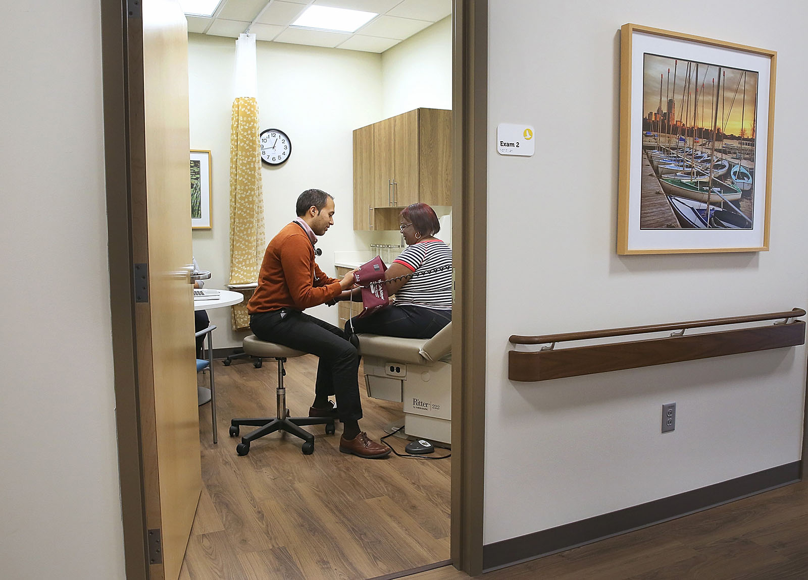 A doctor with a patient in an exam room
